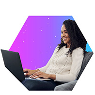 Smiling woman using a laptop, representing reliable 600 Mbps internet for 4K streaming and heavy internet use.